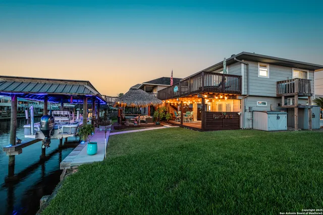 a view of an chairs and table in the back yard