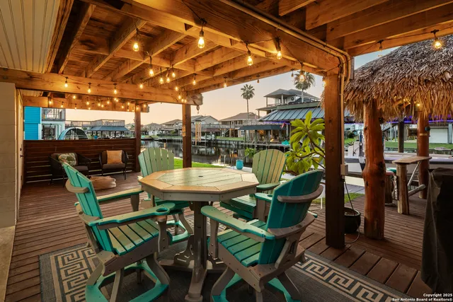 a view of a chairs and table in the patio