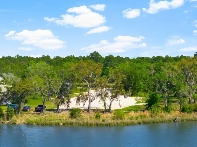 a city street lined with parked cars and buildings