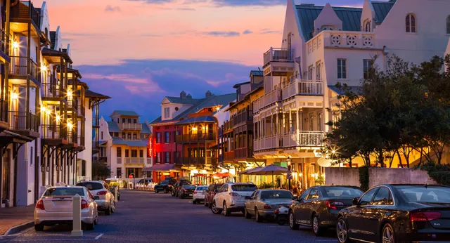 a view of a house with a palm tree
