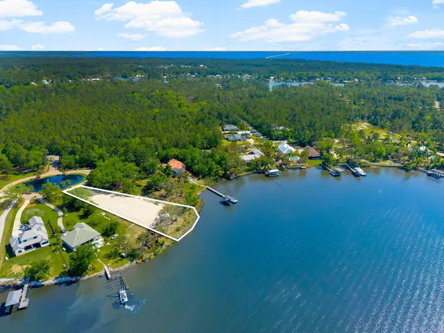 a lake view with a wooden fence
