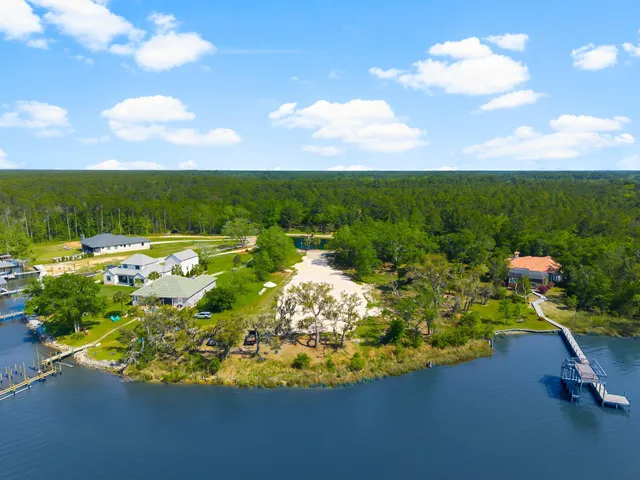a view of yard with swimming pool and green space
