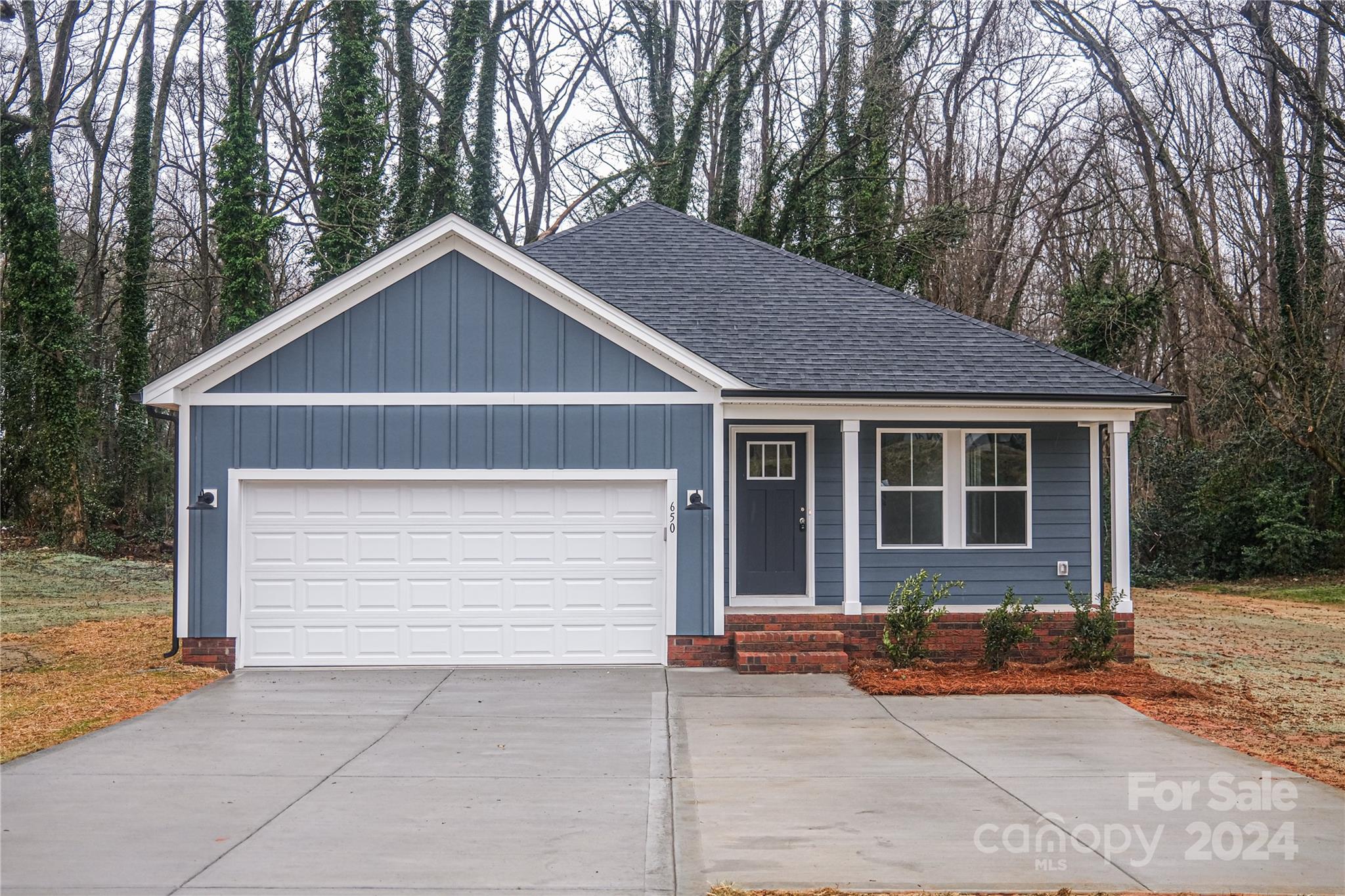 a front view of a house with a garage