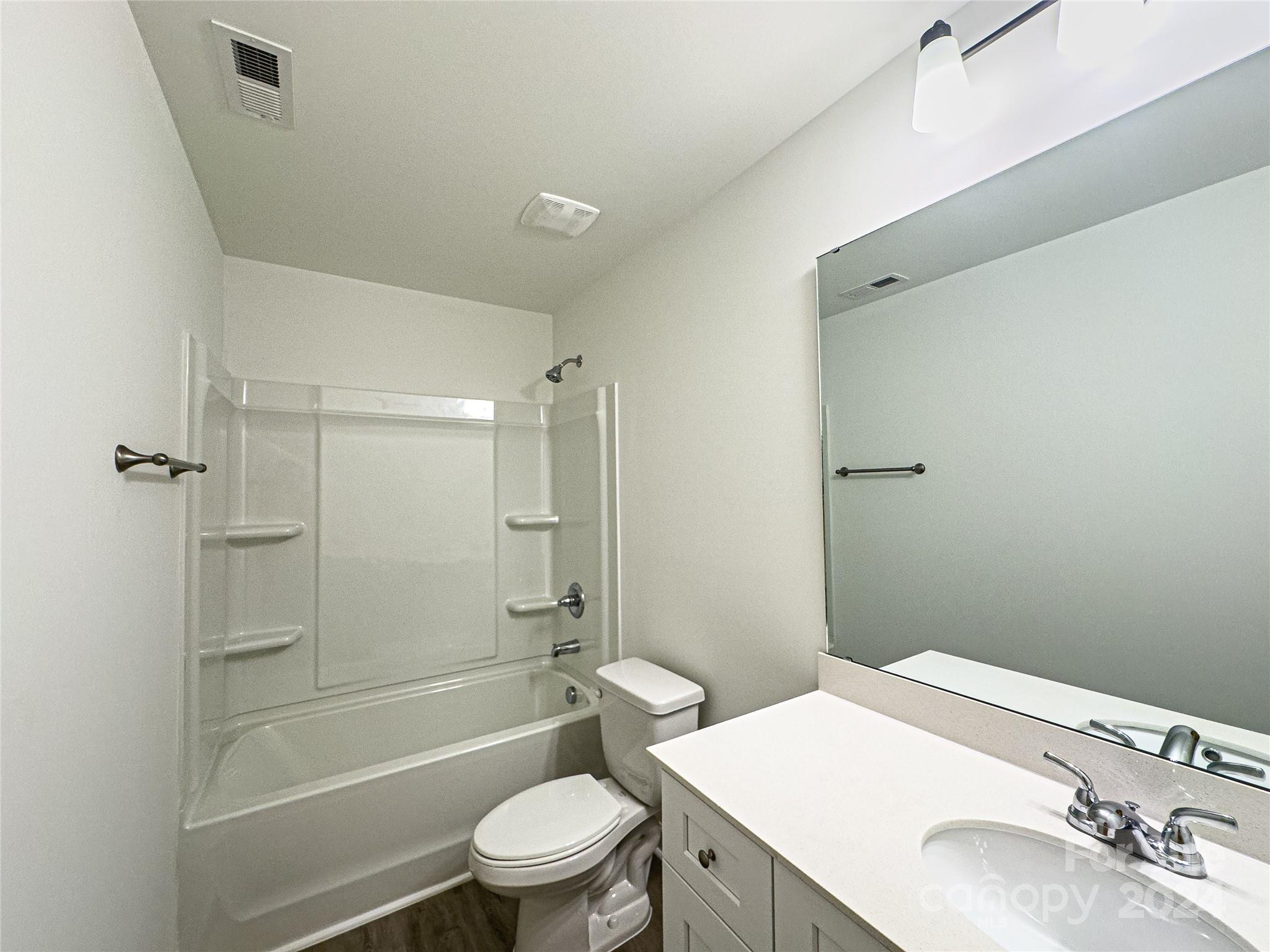 650 Sedgefield Street Southwest Concord, NC 28025 - Photo 5 of 15 a bathroom with a sink a toilet and shower