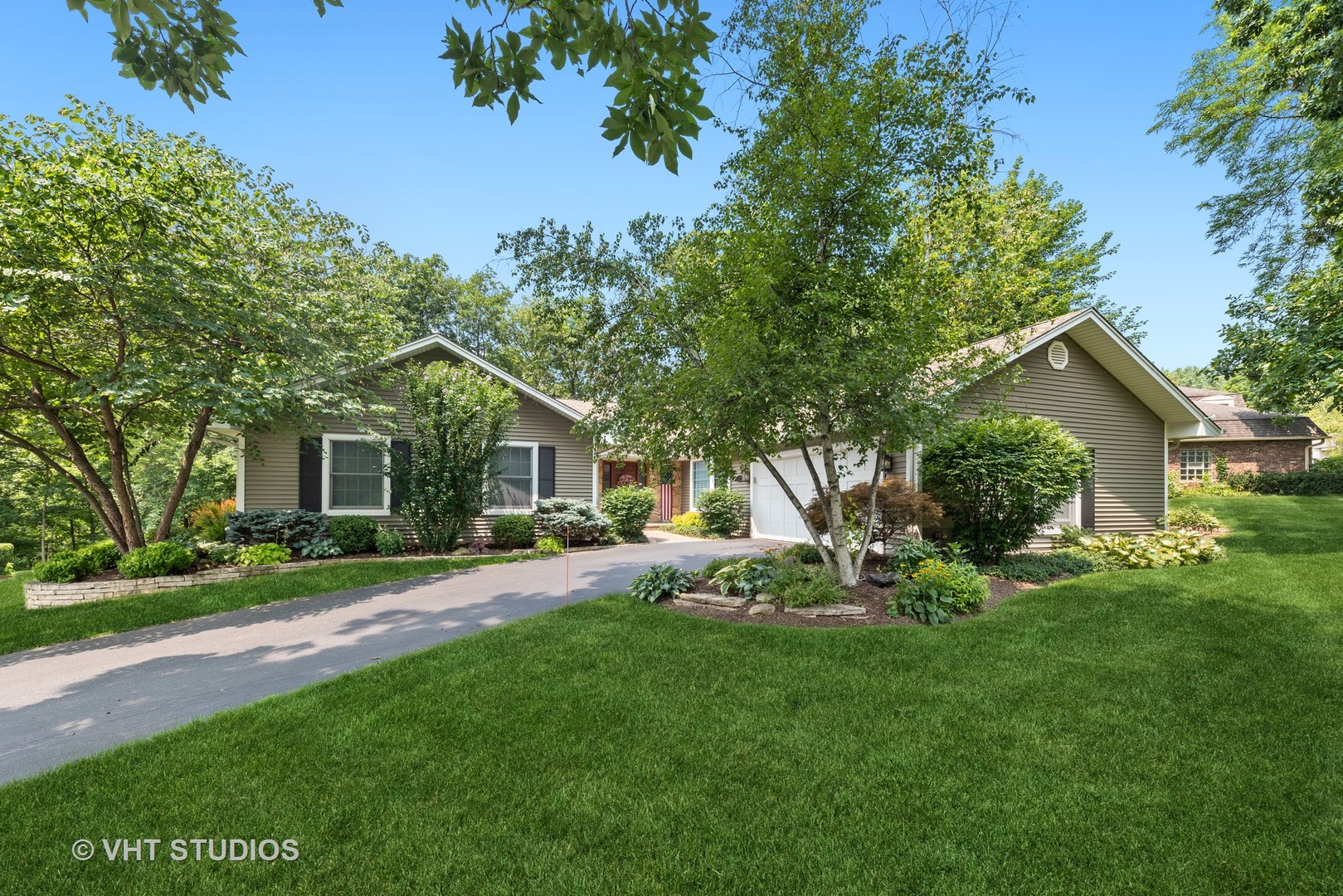 6 Oak Creek Road Rolling Meadows, IL 60008 - Photo 1 of 42 a front view of a house with a yard and trees