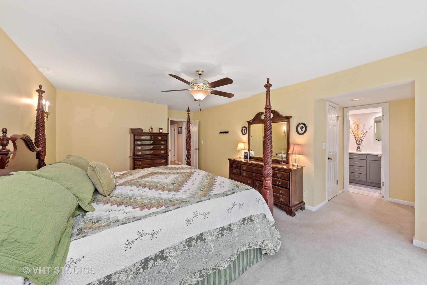 6 Oak Creek Road Rolling Meadows, IL 60008 - Photo 20 of 42 a bed room with a bed a dresser and flowerpot