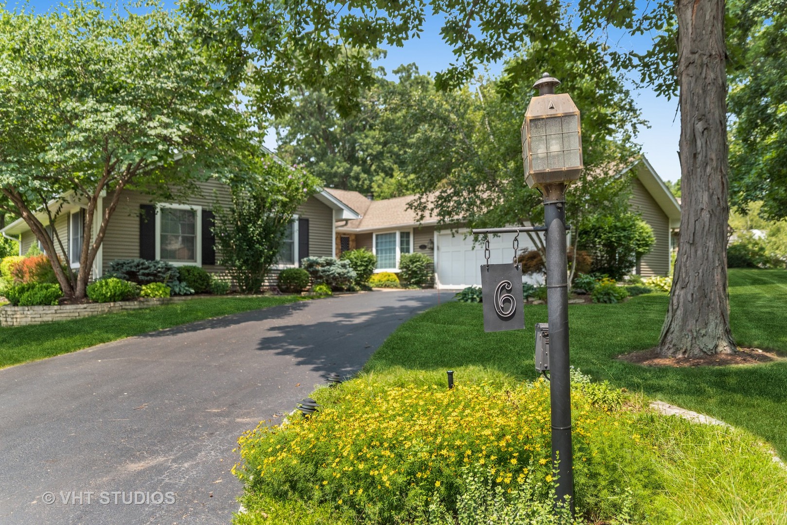 6 Oak Creek Road Rolling Meadows, IL 60008 - Photo 2 of 42 a front view of a house with garden