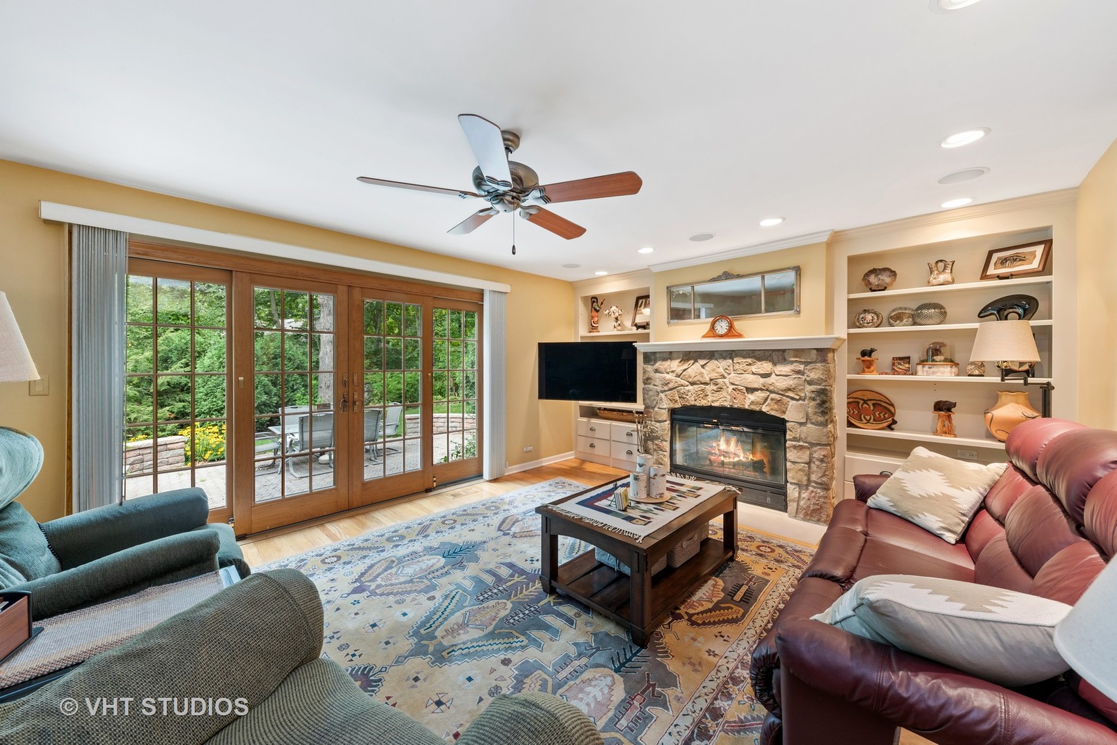 6 Oak Creek Road Rolling Meadows, IL 60008 - Photo 10 of 42 a living room with furniture a flat screen tv and a fireplace