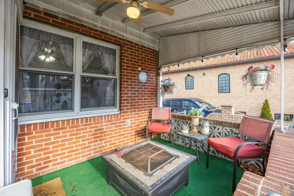 a backyard of a house with outdoor seating