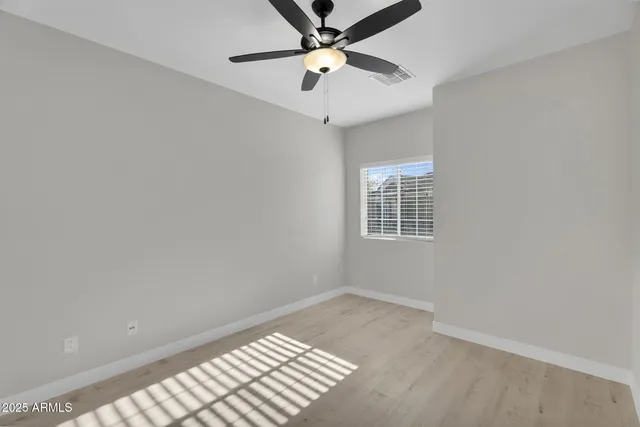 a kitchen with a sink and a refrigerator