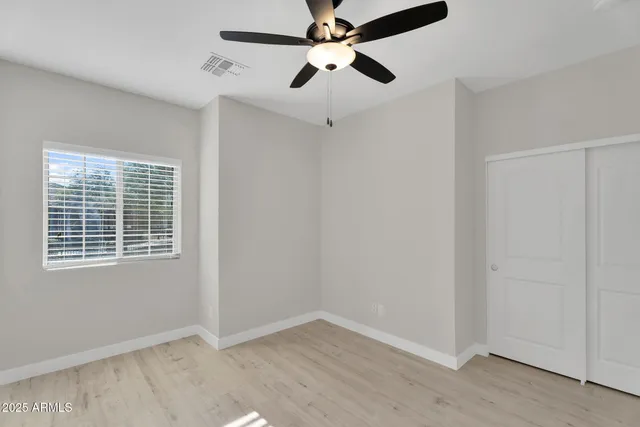 a kitchen with stainless steel appliances granite countertop a sink and a refrigerator