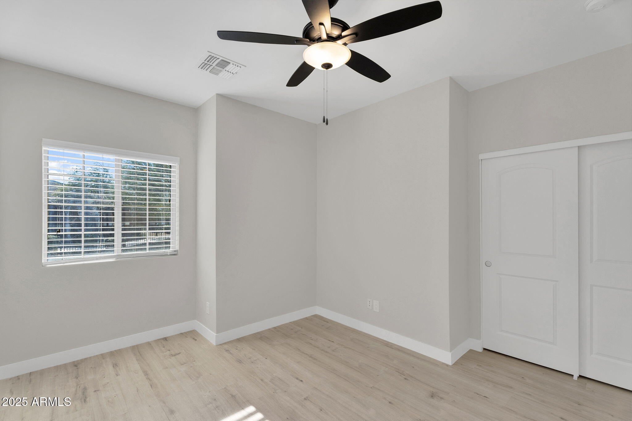 854 South San Marcos Drive, Unit 7C Apache Junction, AZ 85120 - Photo 12 of 48 a view of an empty room with a window and a ceiling fan