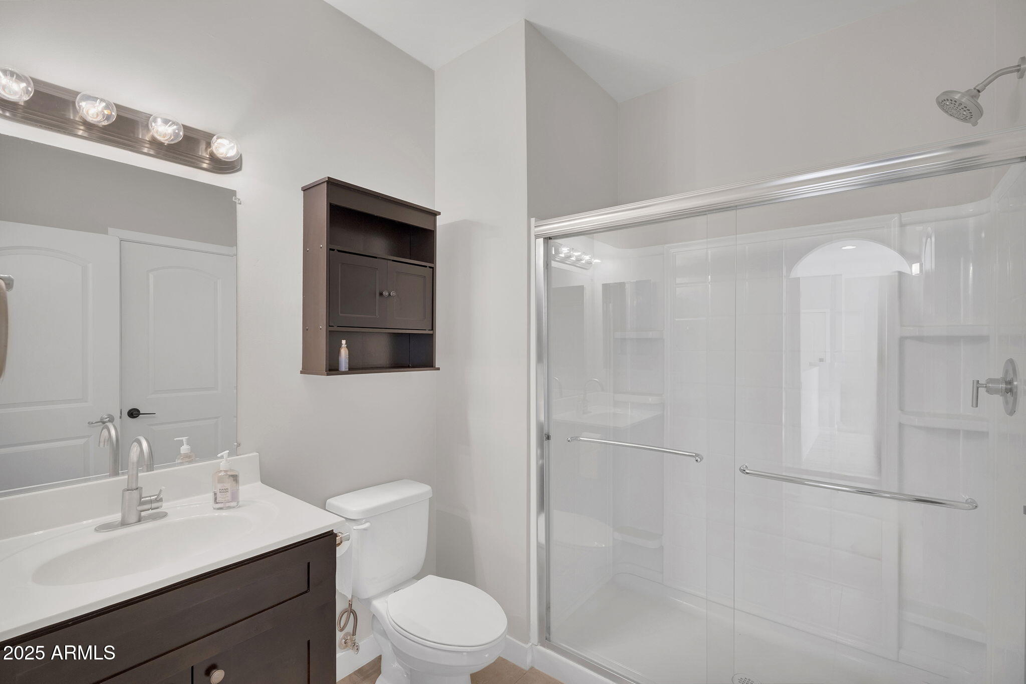 854 South San Marcos Drive, Unit 7C Apache Junction, AZ 85120 - Photo 15 of 48 a bathroom with a sink a toilet and shower