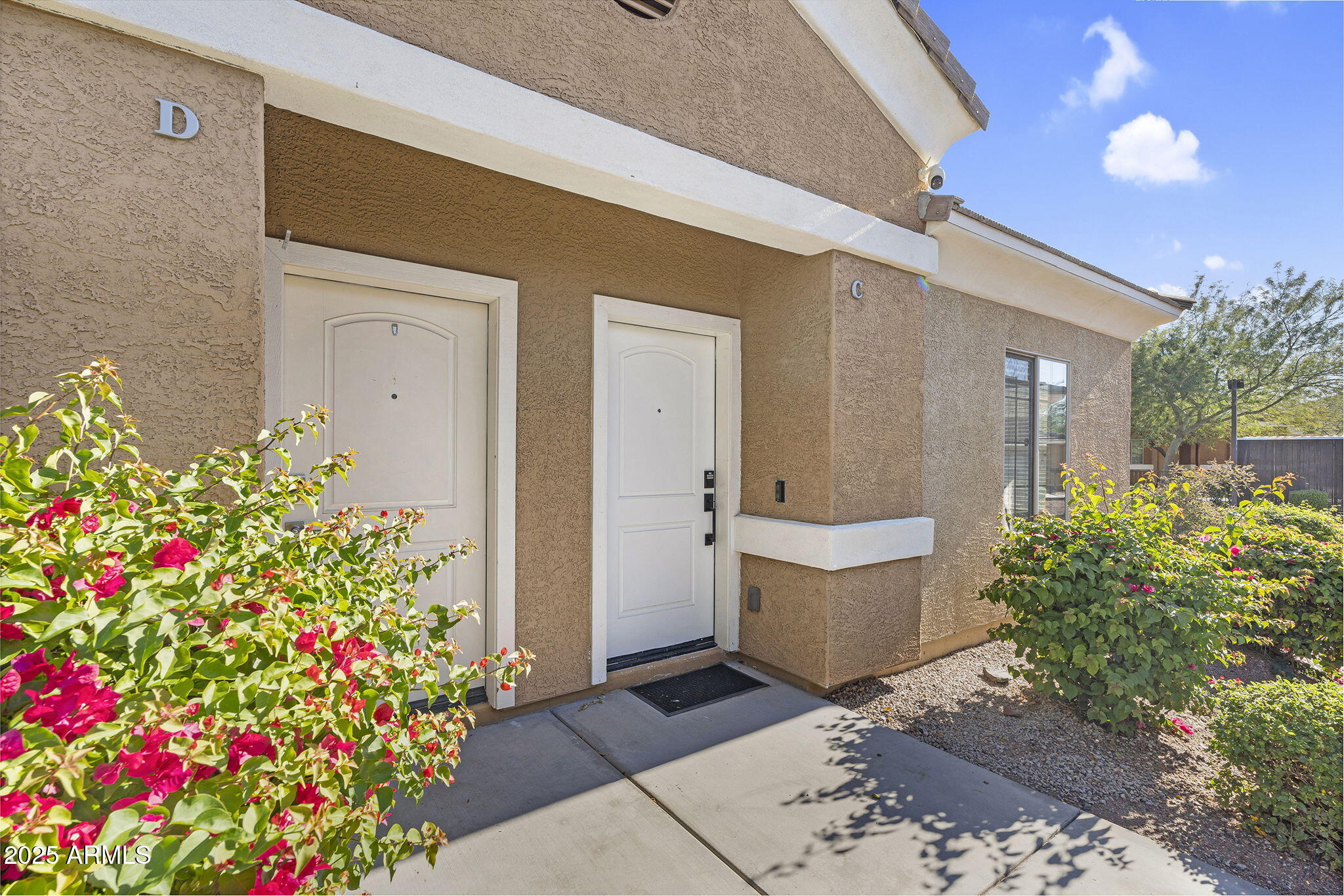 854 South San Marcos Drive, Unit 7C Apache Junction, AZ 85120 - Photo 2 of 48 a front view of a house with flowers