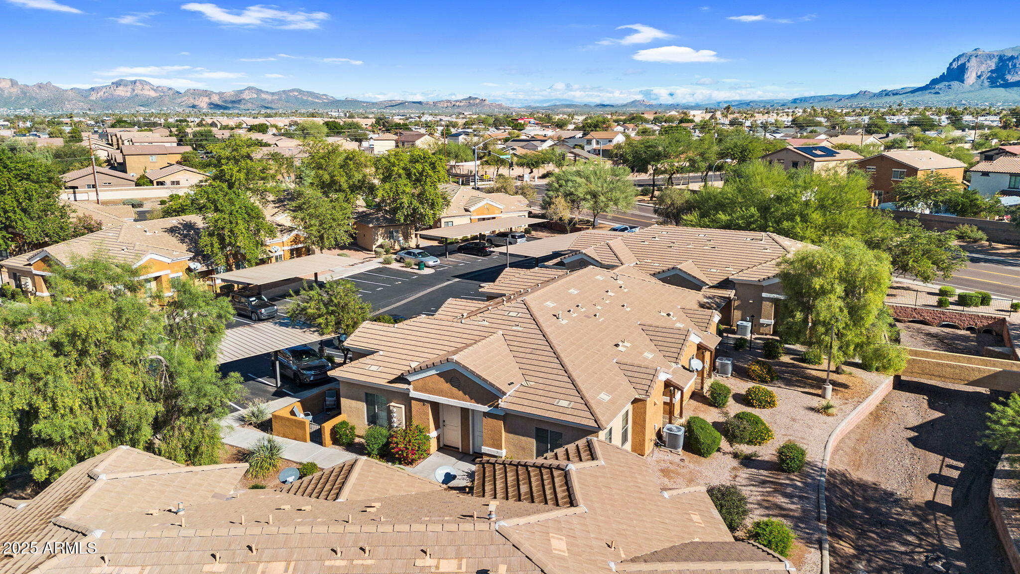 854 South San Marcos Drive, Unit 7C Apache Junction, AZ 85120 - Photo 28 of 48 an aerial view of residential houses with outdoor space