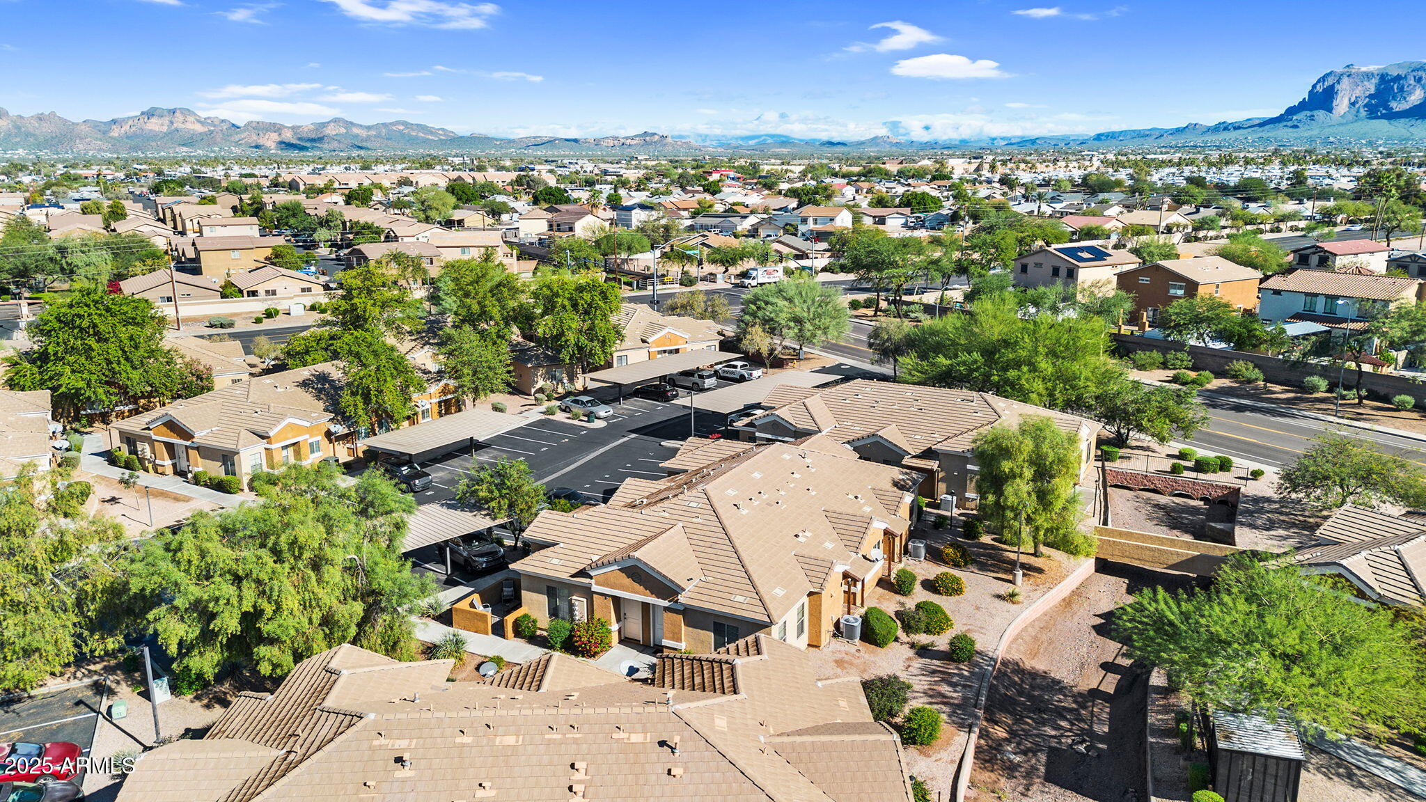 854 South San Marcos Drive, Unit 7C Apache Junction, AZ 85120 - Photo 30 of 48 an aerial view of residential houses with outdoor space