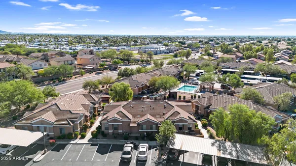 an aerial view of residential houses with outdoor space