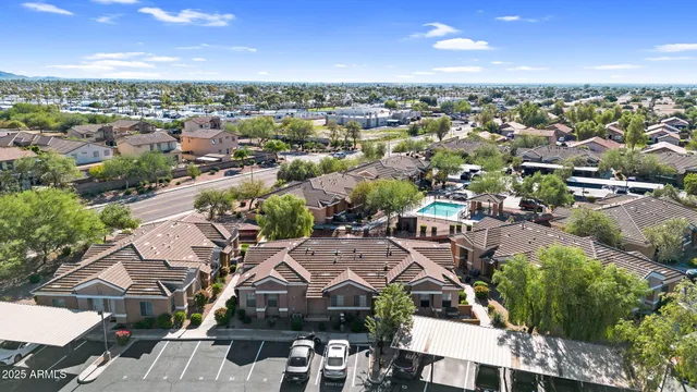 an aerial view of residential houses with outdoor space