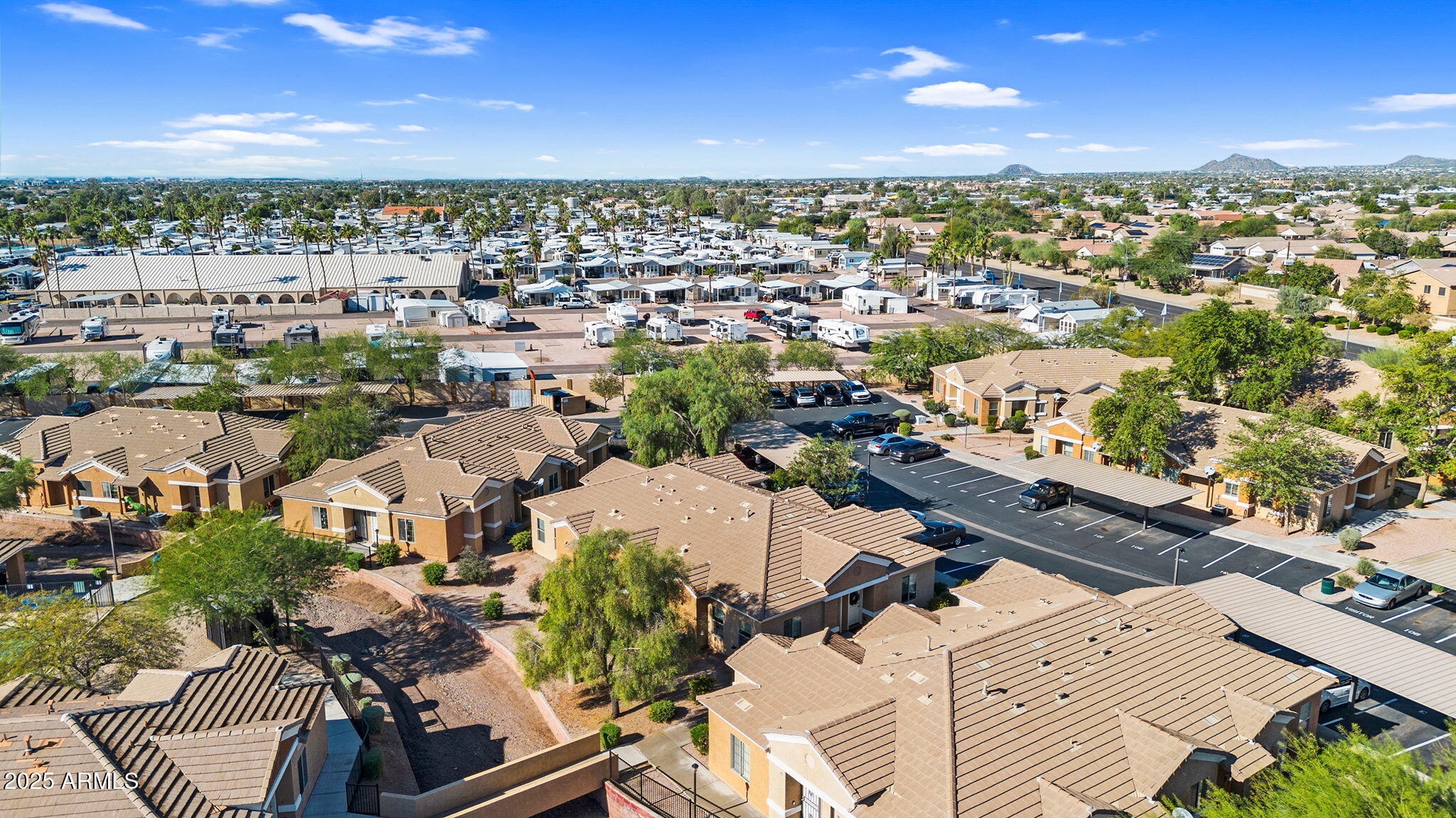 854 South San Marcos Drive, Unit 7C Apache Junction, AZ 85120 - Photo 36 of 48 an aerial view of residential houses with outdoor space