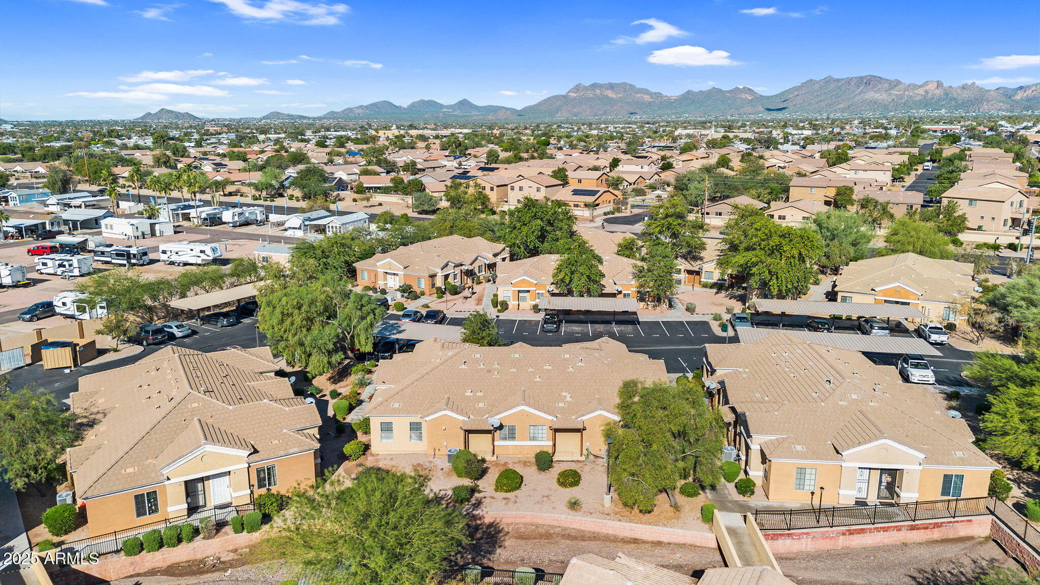 854 South San Marcos Drive, Unit 7C Apache Junction, AZ 85120 - Photo 37 of 48 an aerial view of residential houses with outdoor space and ocean view