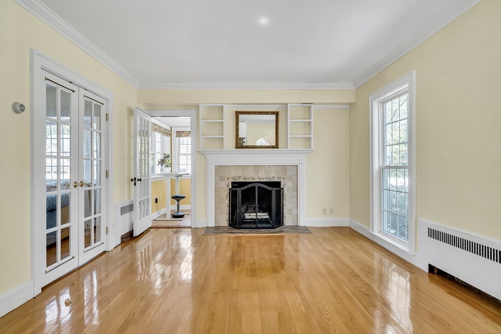36 Sunset Road Wellesley, MA 02482 - Photo 13 of 30 a view of a livingroom with a fireplace window and wooden floor