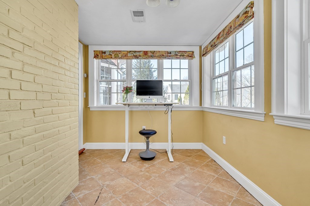 36 Sunset Road Wellesley, MA 02482 - Photo 14 of 30 a view of a livingroom with a fireplace and a window