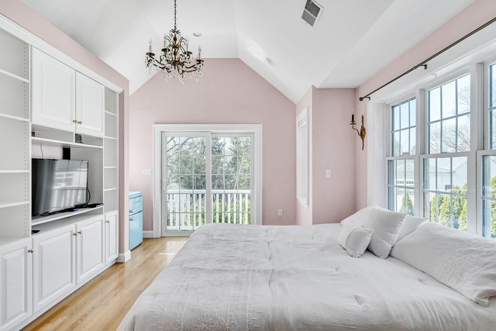 36 Sunset Road Wellesley, MA 02482 - Photo 16 of 30 a bedroom with a large bed and a flat tv screen on dresser