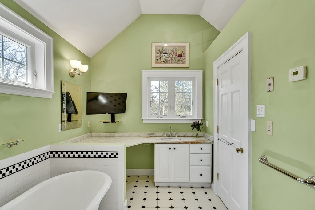 36 Sunset Road Wellesley, MA 02482 - Photo 18 of 30 a bathroom with a sink a mirror and a bathtub