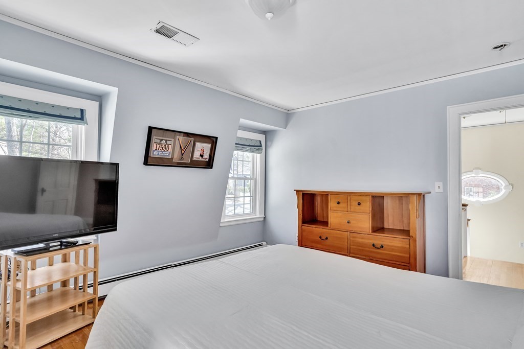 36 Sunset Road Wellesley, MA 02482 - Photo 20 of 30 a bedroom with furniture and a flat screen tv
