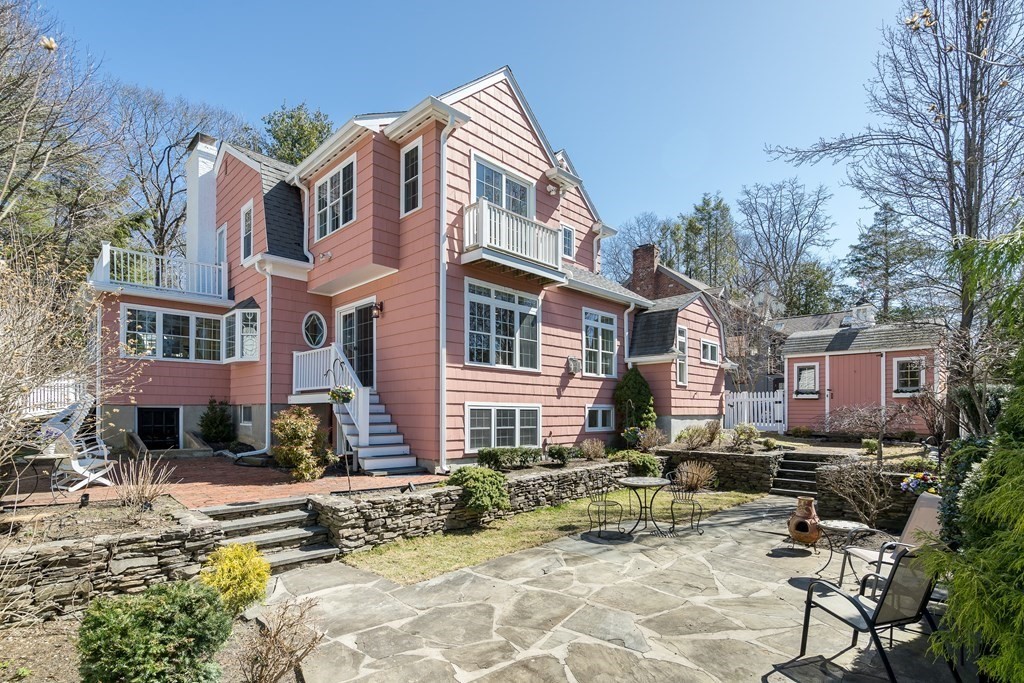 36 Sunset Road Wellesley, MA 02482 - Photo 2 of 30 a view of a patio with a table and chairs