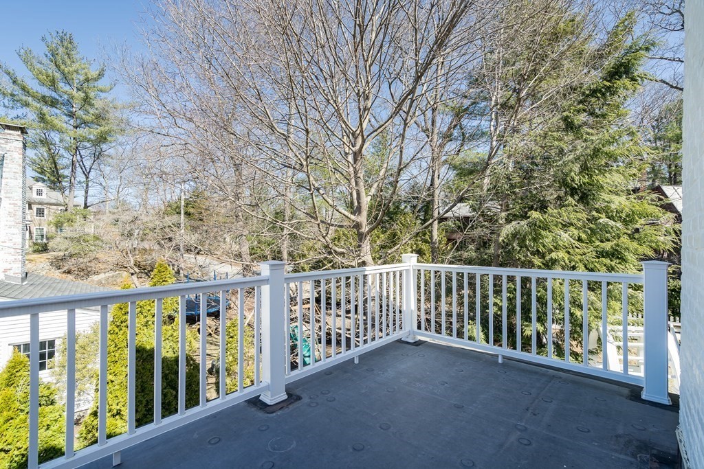 36 Sunset Road Wellesley, MA 02482 - Photo 21 of 30 a view of a balcony with wooden fence and floor