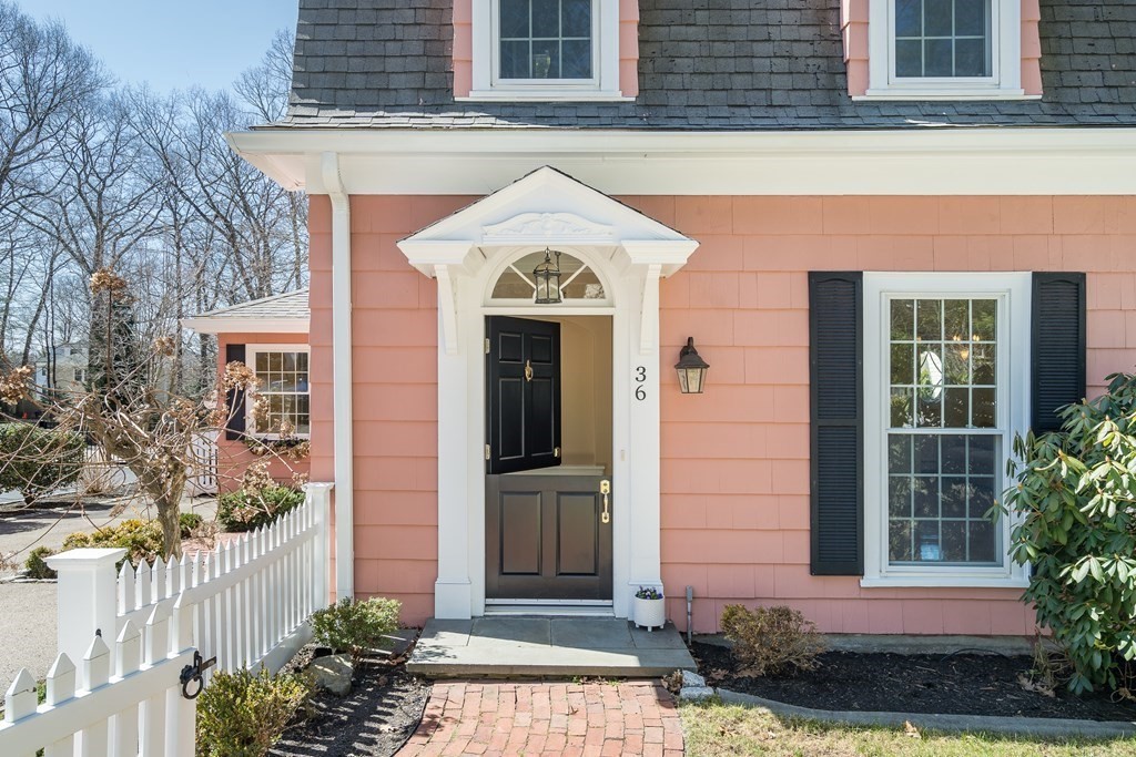36 Sunset Road Wellesley, MA 02482 - Photo 26 of 30 a front view of a house with a garden