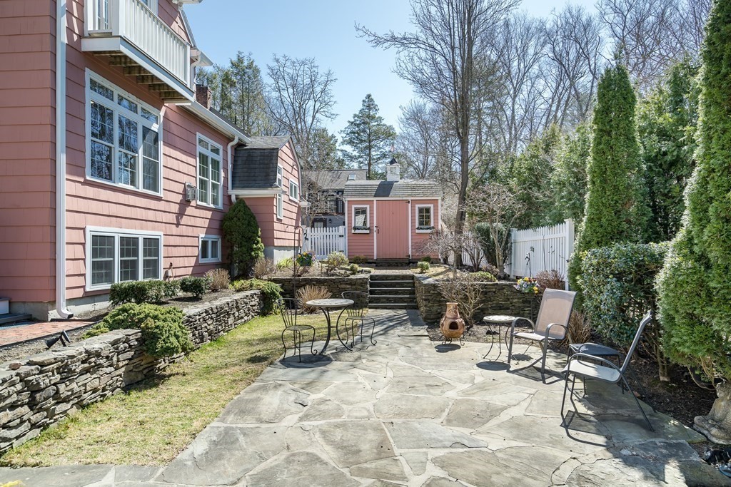 36 Sunset Road Wellesley, MA 02482 - Photo 29 of 30 a view of a patio with a table and chairs in a patio