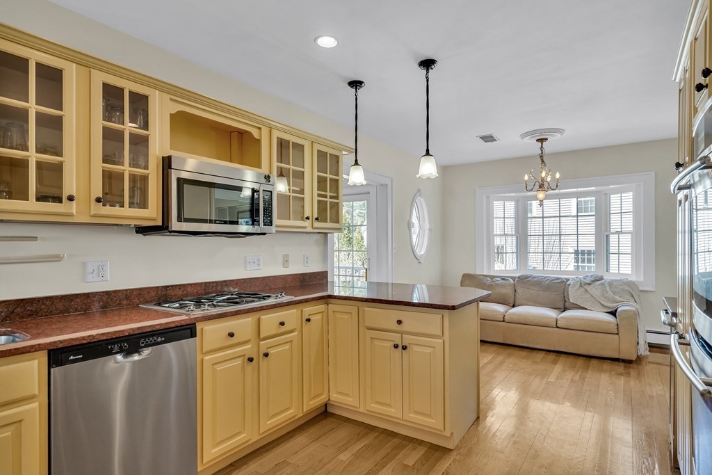 36 Sunset Road Wellesley, MA 02482 - Photo 4 of 30 a kitchen with stainless steel appliances granite countertop a sink a stove and a wooden floors