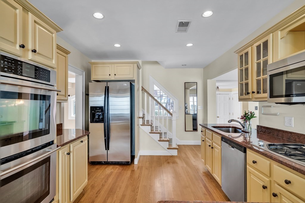 36 Sunset Road Wellesley, MA 02482 - Photo 5 of 30 a kitchen with stainless steel appliances granite countertop a stove and a refrigerator