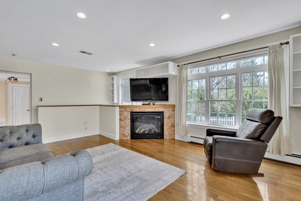 36 Sunset Road Wellesley, MA 02482 - Photo 9 of 30 a bedroom with furniture and a fireplace