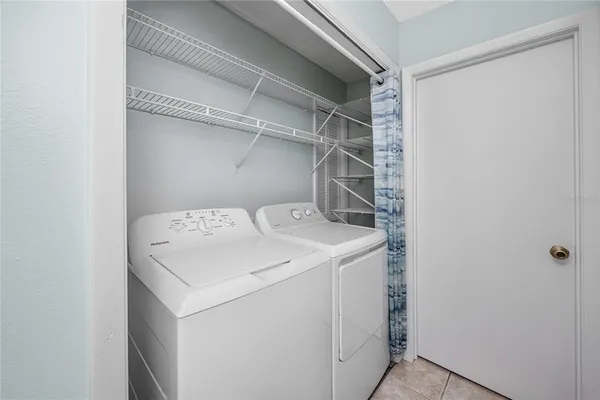 a utility room with wooden floor