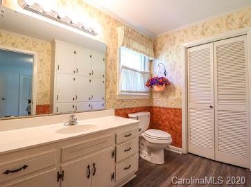 377 Stone Road Salisbury, NC 28146 - Photo 11 of 25 a bathroom with a sink a toilet and a large mirror