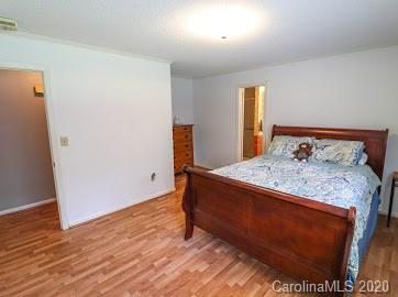 377 Stone Road Salisbury, NC 28146 - Photo 12 of 25 a bed sitting in a bedroom next to a window