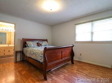 377 Stone Road Salisbury, NC 28146 - Photo 13 of 25 a bed sitting in a bedroom next to a window