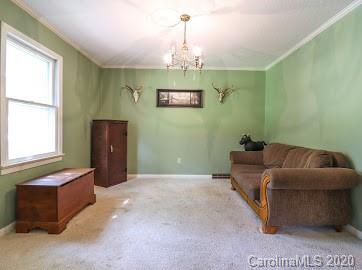 377 Stone Road Salisbury, NC 28146 - Photo 15 of 25 a living room with furniture and a chandelier