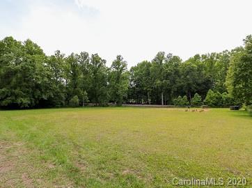 377 Stone Road Salisbury, NC 28146 - Photo 22 of 25 a view of a swimming pool and trees in the background