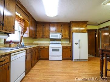 377 Stone Road Salisbury, NC 28146 - Photo 7 of 25 a kitchen with stainless steel appliances granite countertop a refrigerator and a sink