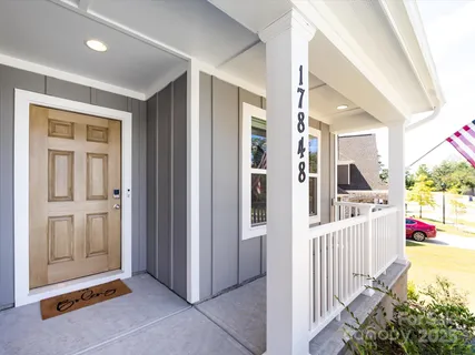 a view of a hallway with entryway door