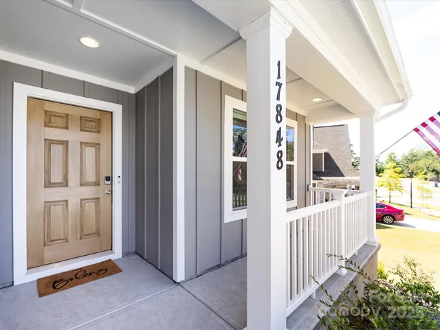 a view of a hallway with entryway door