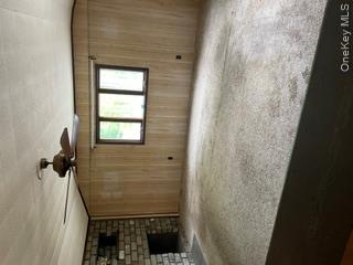 100 Decker Road, Unit 2 Wallkill, NY 12589 - Photo 14 of 23 a view of an empty room with a fireplace and a window