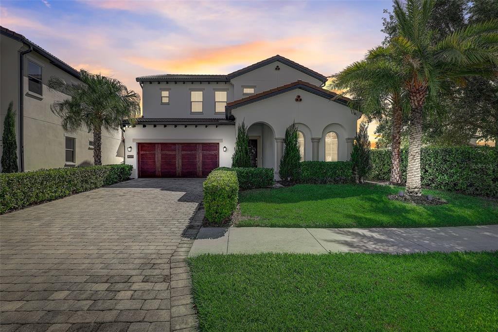 Welcome to Real Life Paradise!! This beautiful Madeira Spanish Colonial Home is Perfectly Located right in the middle of Disney World (less than 1 mile away), Windermere and Dr. Phillips in an UPSCALE 24-HOUR GUARD GATED COMMUNITY WITH a PRIVATE COMMUNITY BOAT RAMP to SOUTH LAKE!!