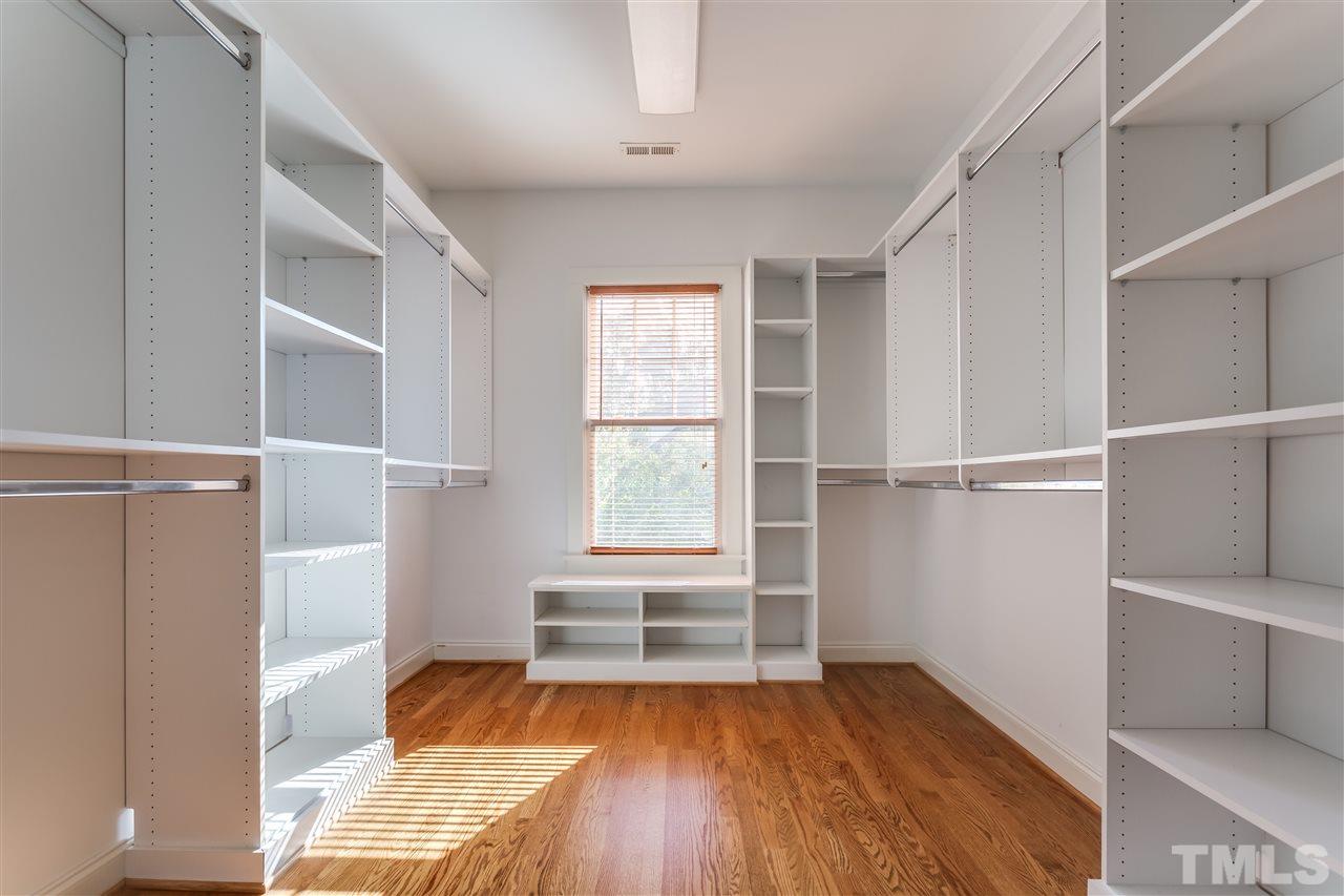 4214 Batiste Road Raleigh, NC 27613 - Photo 22 of 25 a view of walk in closet with empty racks