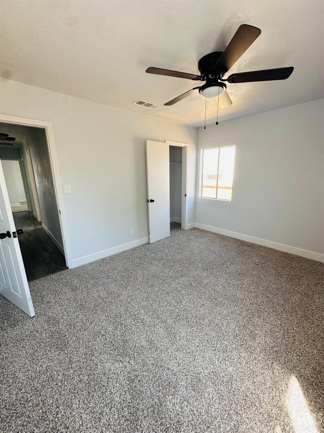 Undisclosed Address Delano, CA 93215 - Photo 12 of 20 a view of a livingroom with a ceiling fan and window