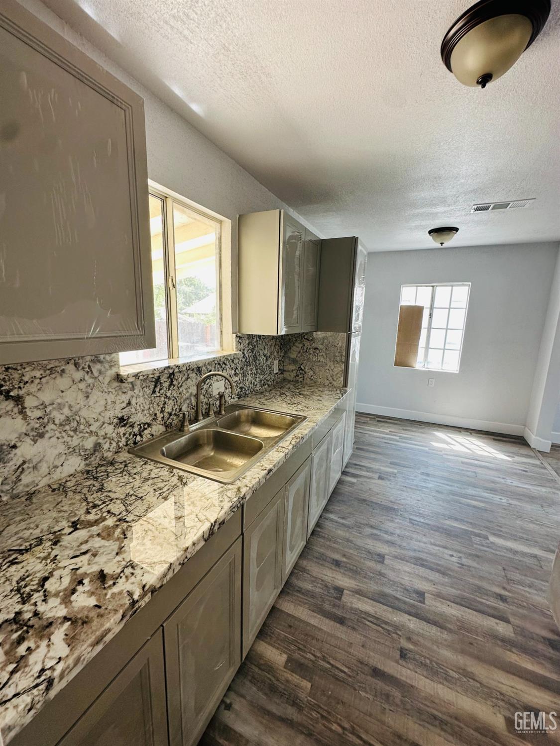 Undisclosed Address Delano, CA 93215 - Photo 15 of 20 a bathroom with a granite countertop sink and a window